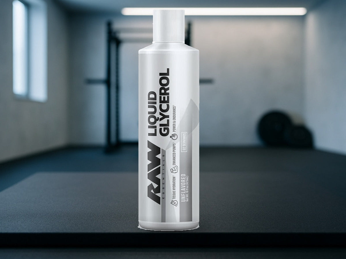 RAW Liquid Glycerol Unflavored bottle on a charcoal gym mat in a soft-focus home gym, product clearly in focus