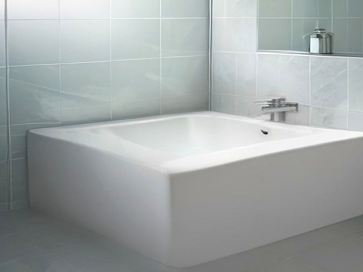 Soft morning bathroom light with steam and water droplets on clean tiles, calm hard-water wash-day lifestyle